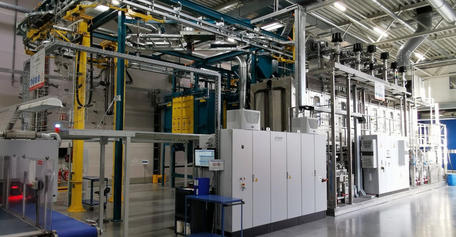 R&ouml;sler RHBD 13/18-So continuous-feed spinner hanger shot-blasting machine