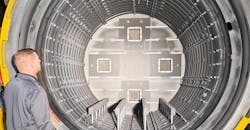 Adam Jones, Midwest regional sales manager at Solar Manufacturing, examines the 48x48x72-inch deep insulated hot zone of a new vacuum furnace at FPM Heat Treating. Adam Jones, Midwest regional sales manager at Solar Manufacturing, examines the 48x48x72-inch deep insulated hot zone of a new vacuum furnace at FPM Heat Treating.