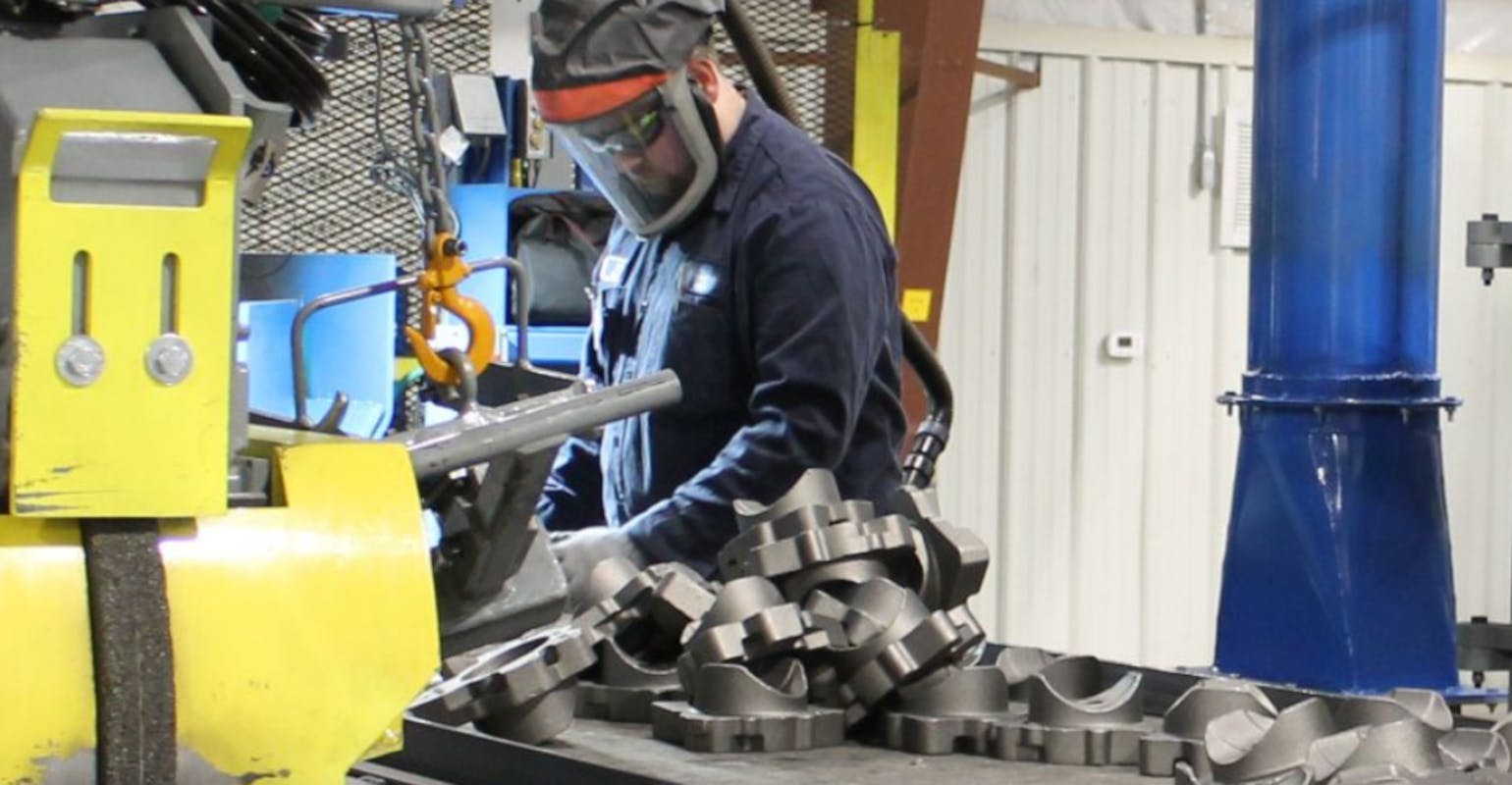 Grinding castings at Waupaca Foundry, Ironwood, MI.