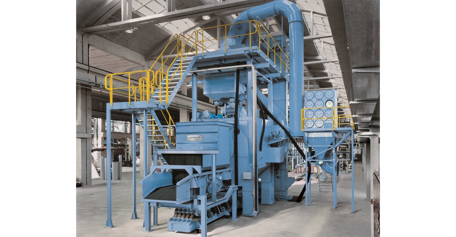 Wheelabrator Continuous Through-Feed Tumblast (CT) machine.