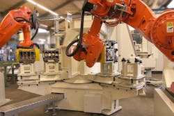 ABB robots in an engine block grinding process. ABB robots in an engine block grinding process.