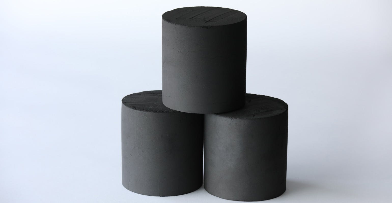 Bio-coal briquettes derived from coconut shells.