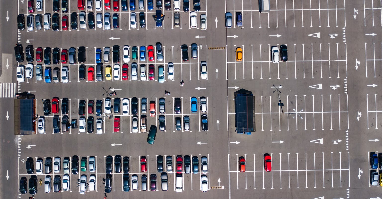 Aerial view of cars parked in a lot.