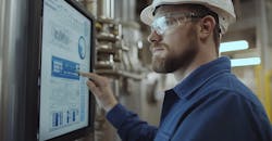 Touchscreen display showing industrial data process flowcharts and system analytics. Touchscreen display showing industrial data process flowcharts and system analytics.