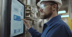 Touchscreen display showing industrial data process flowcharts and system analytics. Touchscreen display showing industrial data process flowcharts and system analytics.