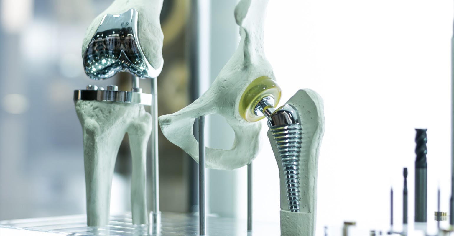 Prosthetic knee and hip joints