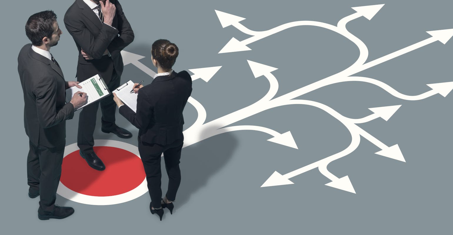 Team planning strategies for their business, pondering direction and making decisions together.