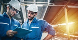 Plant operators with checklist. Plant operators with checklist.