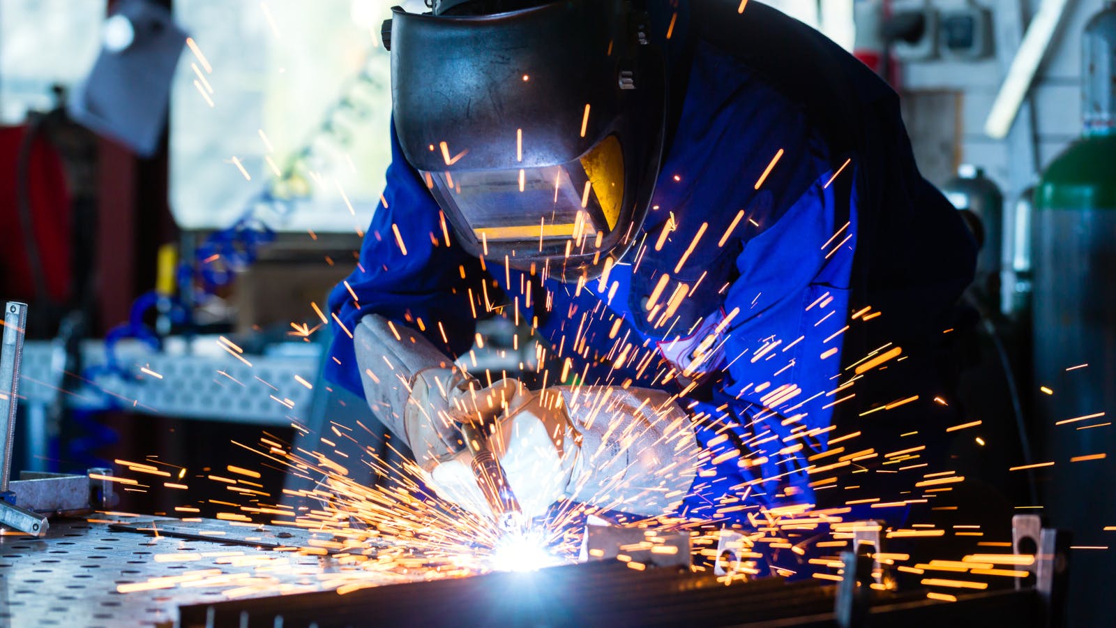 A welder uses a welding torch.