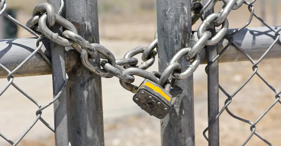 Lock on a chain link security fence.