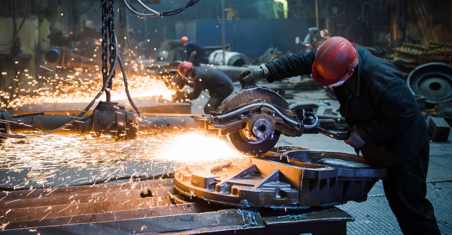 Grinding large iron casting.