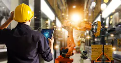 Engineer monitors control automation robot arms. Engineer monitors control automation robot arms.