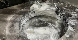 A ladle in an aluminum melting furnace in a diecasting operation.