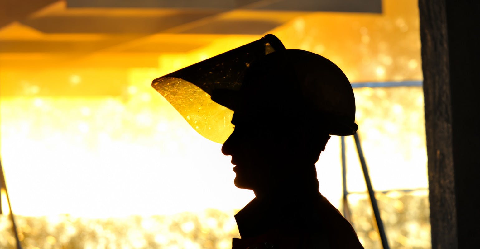 Iron casting plant worker.