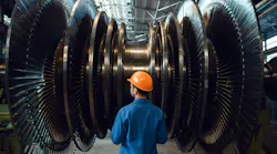 Worker checks turbine impeller vanes.